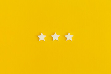 Three 3 stars, best excellent services rating on yellow background.