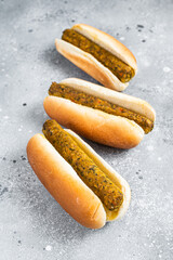Vegan hot dog with meatless Vegetarian sausage. Gray background. Top view