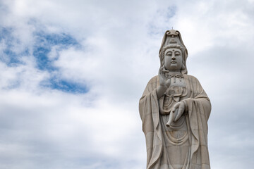 Guanyin statue, the Chinese Goddess of Mercy and Compassion,  at the Kuang-Im Chapel, a new and unfinished Chinese-style Buddhist temple in Kanchanaburi, Thailand