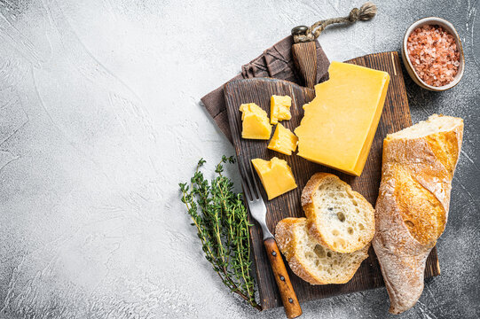 Gouda Cheese With Bread Ready For Cooking Sandwich. White Background. Top View. Copy Space