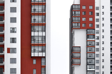 red and white high-rise building with balconies