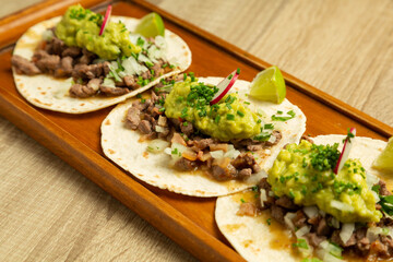 closeup of tacos with guacamole typical mexican food