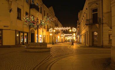 Nowy Sacz at night in winter, Jagiellonska street and Walowa street, Malopolska, Poland - obrazy, fototapety, plakaty