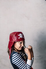girl dressed as a pirate, with hands with clenched fists