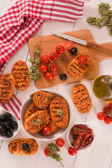 Toasted bread with tomato and oregano.