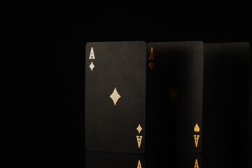 Casino, online casino. Black poker cards on a black background. 3d image. Gambling, sports poker,...