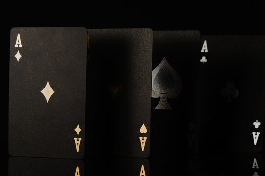 3d image. Poker cards, three aces on a black background. Minimalism. There are no people in the photo. macro photography. Casino, online casino, nightlife. risk, chance of winning.