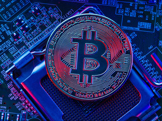 Desktop processor pins up on the motherboard of a personal computer and bitcoin. New computer and financial technologies, cryptocurrency, cryptocurrency mining, crypto farms.