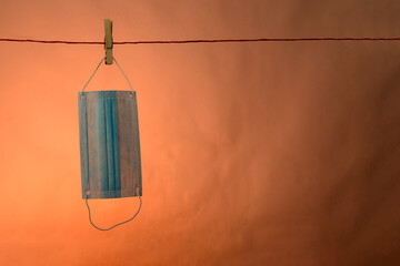 Protection mask against corona virus isolated on a brown background, covid-19.