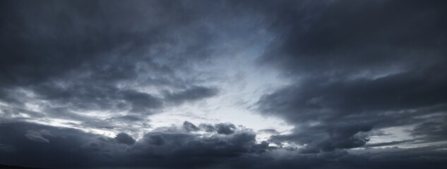 Dark ornamental clouds. Dramatic sky. Epic storm cloudscape. Panoramic image, texture, background, graphic resources, design, copy space. Meteorology, weather, thunderstorm. hurricane concepts © Alex Stemmer