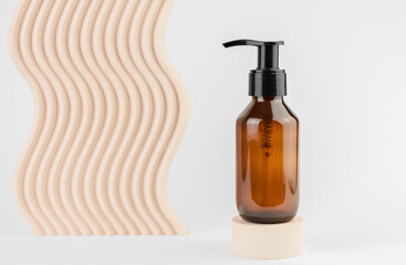 Cosmetic bottle with a dispenser on a white background with geometric shapes. Cosmetic bottle on the podium. SPA products