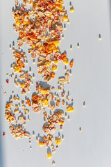 Different sorts of breakfast cereal products. Set with different cereal grains on white background, top view. Sunny breakfast concept.