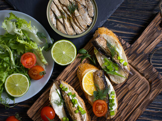 sandwich in a can, fresh dill on wooden background