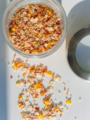 Different sorts of breakfast cereal products. Set with different cereal grains on white background, top view. Sunny breakfast concept.