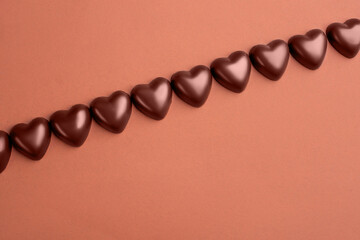 heart shaped chocolates on brown paper background