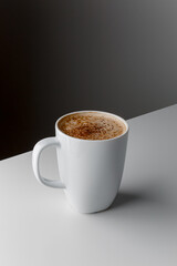 Hot coffee cappuccino in ceramic cup isolated on white background, clipping path included. cappuccino with spices and cinnamon. Cozy morning concept. Hygge.