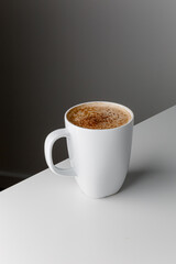 Hot coffee cappuccino in ceramic cup isolated on white background, clipping path included. cappuccino with spices and cinnamon. Cozy morning concept. Hygge.