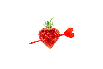 Strawberry in the shape of a heart, pierced by a red arrow on a white background.Valentine's Day concept.Creative minimalistic flat lay.