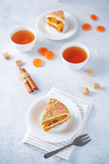 Carrot cake with cream cheese filling in a plate
