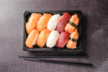 Sushi to go concept. Takeaway box with sushi