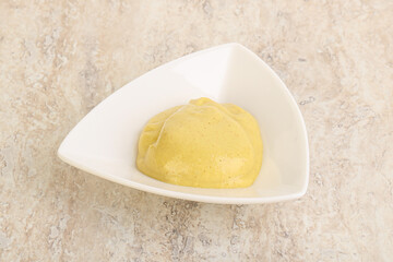 Organic mustard sauce in the bowl
