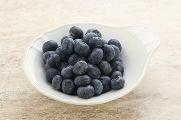 Sweet ripe blueberry heap in the bowl