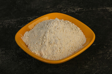Wheat flour heap in the bowl