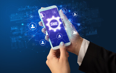 Hand using smartphone with technology concept