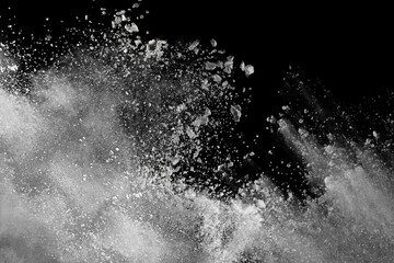 White powder explosion on black background. Colored cloud. Colorful dust explode. Paint Holi.