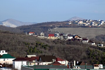 The city at the foot of the mountains from the height of a bird's flight