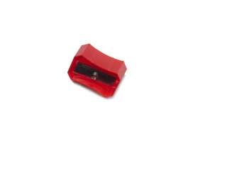 Pencil sharpener . Red sharpener on a white background.   Set for schoolchild