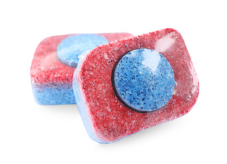Two dishwasher detergent tablets on white background