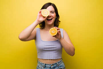Excited woman eating fresh fruit