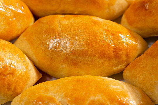 Traditional turkish breakfast savory pastry food close-up top view. It is known as Poaca or Poğa&ccedil;a in Turkish. It is a very popular breakfast food. Cheese, olives, sausage can be put inside.