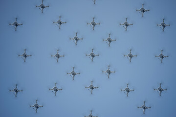 synchronized drones in formation in the air