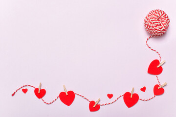 Valentine's Day background with thread and hearts. Copy space.