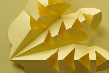 abstract composition with cut paper in yellow