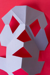 abstract composition with cut paper in lavender violet and red