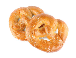 Tasty freshly baked pretzels on white background, top view