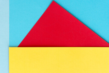 blue, red, and yellow paper background