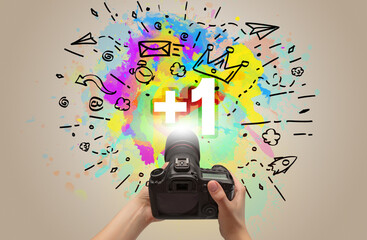 Close-up of a hand holding digital camera with abstract drawing concept