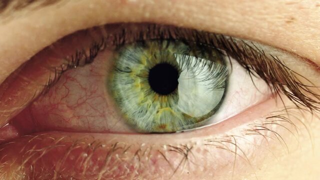 zoom in shot close up of human male eye. transition zoom to infinity black