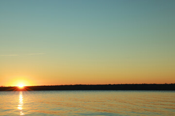 Picturesque view of beautiful sunset over calm river