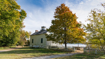 Historic Jones Point Lighthouse on the Potomac River on a Sunny Autumn Day. Alexandria, VA.