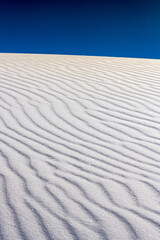 Fototapeta na wymiar Looking Uphill at Waves of Rippling Sand