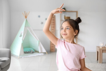 Adorable little ballerina dancing at home © Pixel-Shot