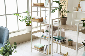 Stylish interior of living room with bookshelf