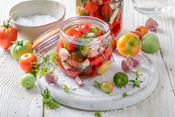 Preparation for pickled tomatoes with dill, garlic and horseradish.