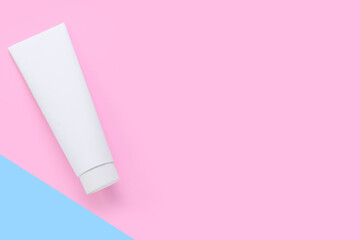 Tube with tooth paste on color background