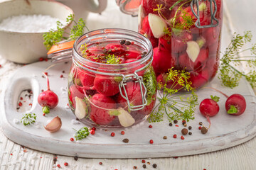 Healthy pickled radishes made of vegetables from backyard greenhouse.